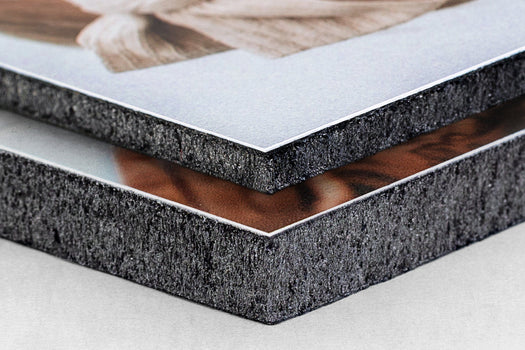 Close-up Corner detail of two photo prints stacked on top of each over. The top print is mounted on 3/16" gatorboard and the bottom print is mounted on 1/2" gatorboard - Nations Photo Lab